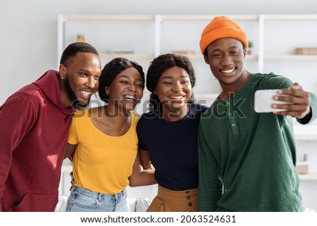 Image, Stock Photo Cheerful black friends taking selfie in city