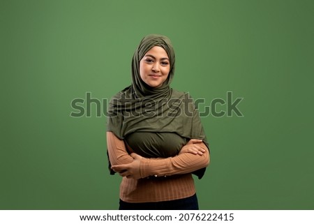 Similar – Image, Stock Photo Portrait of a Muslim woman in traditional cloth in front of wooden door frame