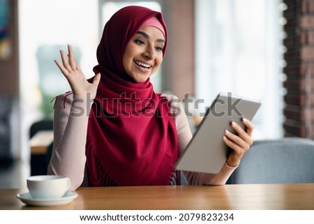 Similar – Foto Bild Muslimische Frau mit Tablet auf der Couch