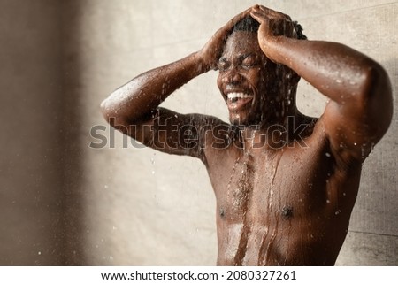 Similar – Image, Stock Photo Man taking shower in wooden bathroom