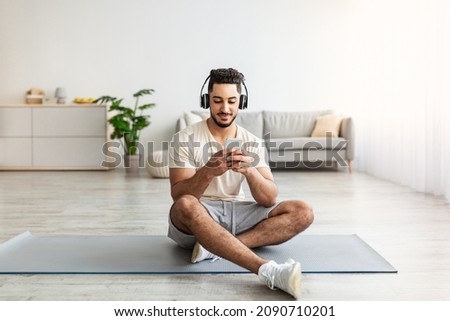 Similar – Image, Stock Photo Athletic man using his mobile phone.