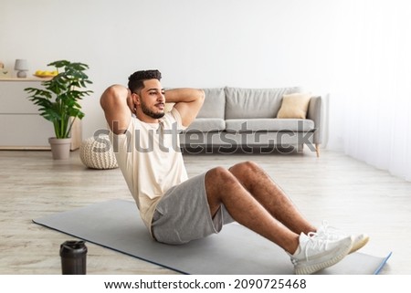 Similar – Man training yoga on beach