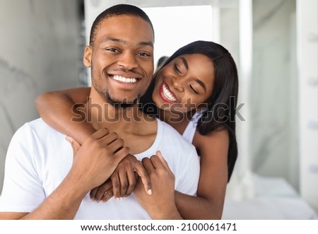 Similar – Image, Stock Photo Romantic black couple embracing on street