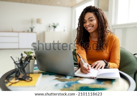 Similar – Image, Stock Photo Young black woman using smartphone and laptop in car