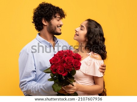 Similar – Image, Stock Photo Happy couple embracing on window sill at home