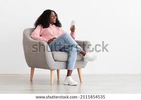 Similar – Image, Stock Photo Positive young lady sitting on bicycle on city street in sunlight