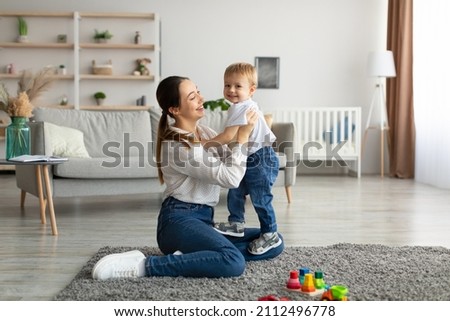 Similar – Image, Stock Photo Mother and son playing inside a cardboard box