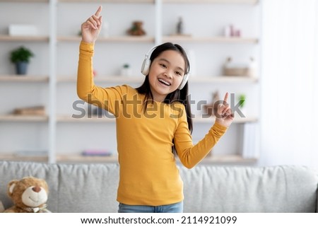 Similar – Image, Stock Photo Little girl singing dancing imitating herself a real singer