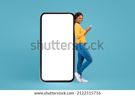 Image, Stock Photo Cheerful black woman leaning on railing in port