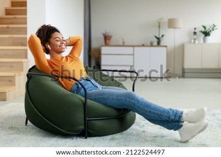 Similar – Image, Stock Photo African American woman sitting at on couch home