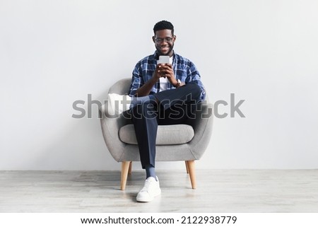 Similar – Image, Stock Photo Black man using smartphone on street