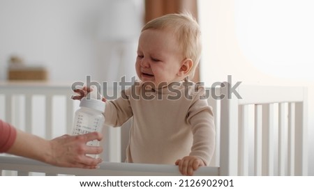 Similar – Image, Stock Photo Toddler drinking milk bottle