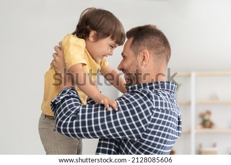 Similar – Image, Stock Photo Young man lifts his bike