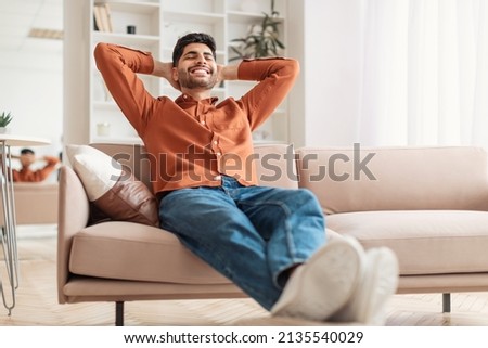 Similar – Image, Stock Photo Calm man relaxing on beach at sundown