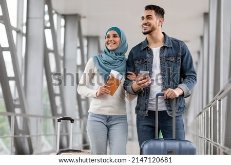 Similar – Image, Stock Photo Happy newlywed couple standing against waving sea