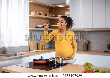 Similar – Image, Stock Photo Black woman enjoying fries and burger in restaurant