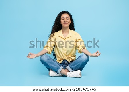 Similar – Image, Stock Photo Peaceful Arab woman doing yoga on embankment