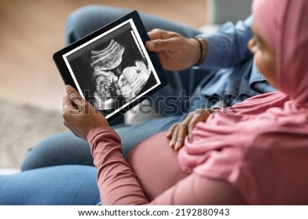 Similar – Image, Stock Photo Woman holding the ultrasound of her baby