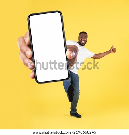 Similar – Image, Stock Photo Cheerful black man in stylish outfit on street