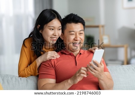 Similar – Image, Stock Photo Happy couple having video conversation on laptop at home