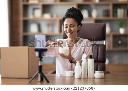 Similar – Image, Stock Photo Young arab woman opening a box with products while smiling, concept retail and buying online