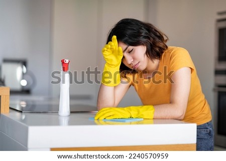 Similar – Image, Stock Photo Tired Arab woman wiping face with towel after training