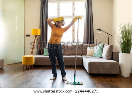 Similar – Image, Stock Photo Tired Arab woman wiping face with towel after training