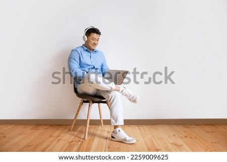 Similar – Image, Stock Photo Man with headphones working on computer