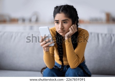 Similar – Image, Stock Photo Worried woman looking from the window of her flat, mental health concept in the city, depression with copy space