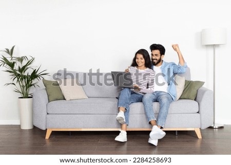 Similar – Image, Stock Photo Loving couple sitting on car on road near forest