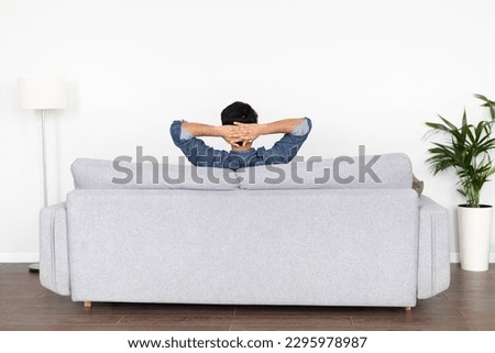 Similar – Image, Stock Photo Unrecognizable man resting at poolside