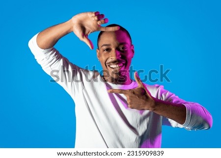 Similar – Image, Stock Photo Cheerful black showing frame gesture on city street