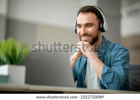 Similar – Image, Stock Photo Man with headphones working on computer