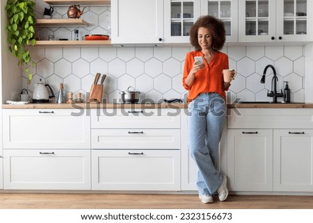 Similar – Image, Stock Photo Young black woman using smartphone and laptop in car