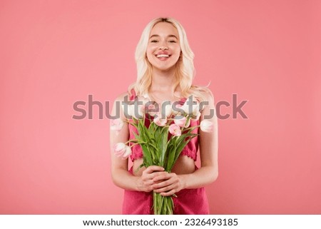 Similar – Image, Stock Photo Hand holding bouquet of pink and white flowerson wooden table at flower shop. Floristics and selling flowers small business. Pink fresh spring floral background with copy space on light gray background.