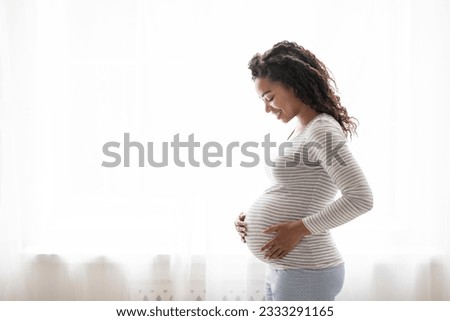 Similar – Image, Stock Photo pregnant black woman relaxing on bed with a laptop at home