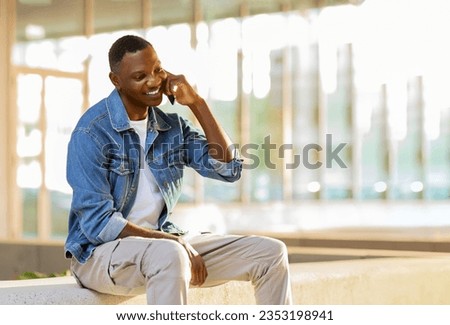 Image, Stock Photo Man talking on smartphone while browsing laptop