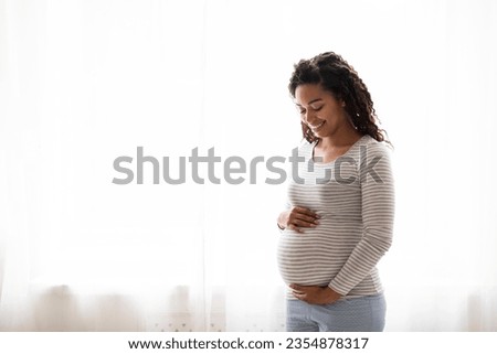 Image, Stock Photo pregnant black woman relaxing on bed with a laptop at home