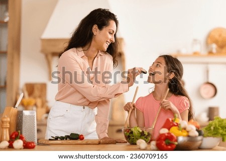 Similar – Image, Stock Photo Mother feeding child at home