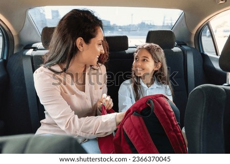 Similar – Image, Stock Photo Mother and daughter sit in the Lotus position in the garden. The family practices yoga outdoors. Back view, space for text