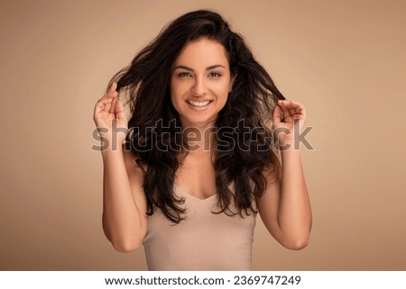 Similar – Image, Stock Photo Young Woman Touching Hair and Looking Away