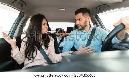 Similar – Image, Stock Photo Male passenger with seat belt fastened while sitting on airplane for safe flight.