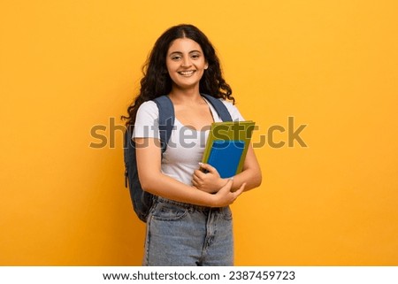 Similar – Image, Stock Photo Young female in yellow shirt sitting in her sewing workshop in front of the colorful threads and sewing machines