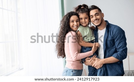 Image, Stock Photo Happy young family near lake, pond. Family enjoying life together at meadow. People having fun in nature. Family bonds outside. Mother, father, child smiling while spending free time outdoors