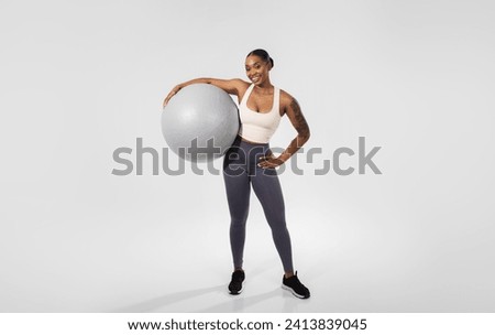 Similar – Image, Stock Photo Happy African American sportswoman with bottle of water