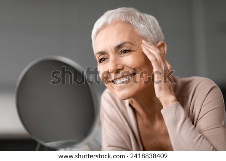 Similar – Image, Stock Photo Senior woman and her adult daughter playing cards at home