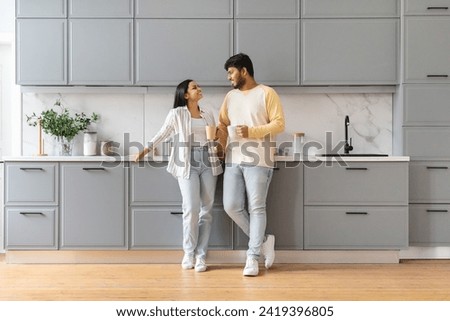 Similar – Image, Stock Photo Happy young couple drinking beverages outdoors