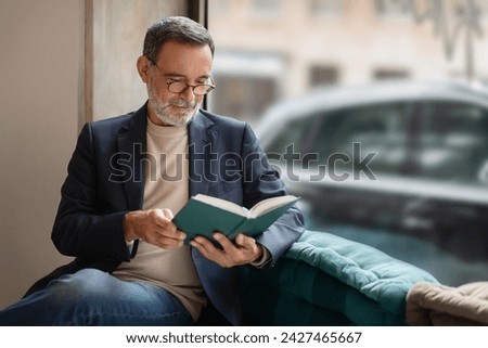 Similar – Image, Stock Photo Mature man reading book at home