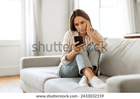 Similar – Image, Stock Photo Worried woman looking from the window of her flat, mental health concept in the city, depression with copy space