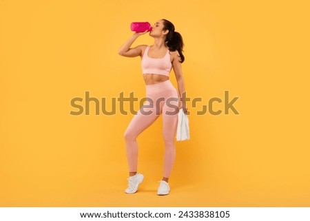 Similar – Image, Stock Photo Slim sportswoman drinking water in park